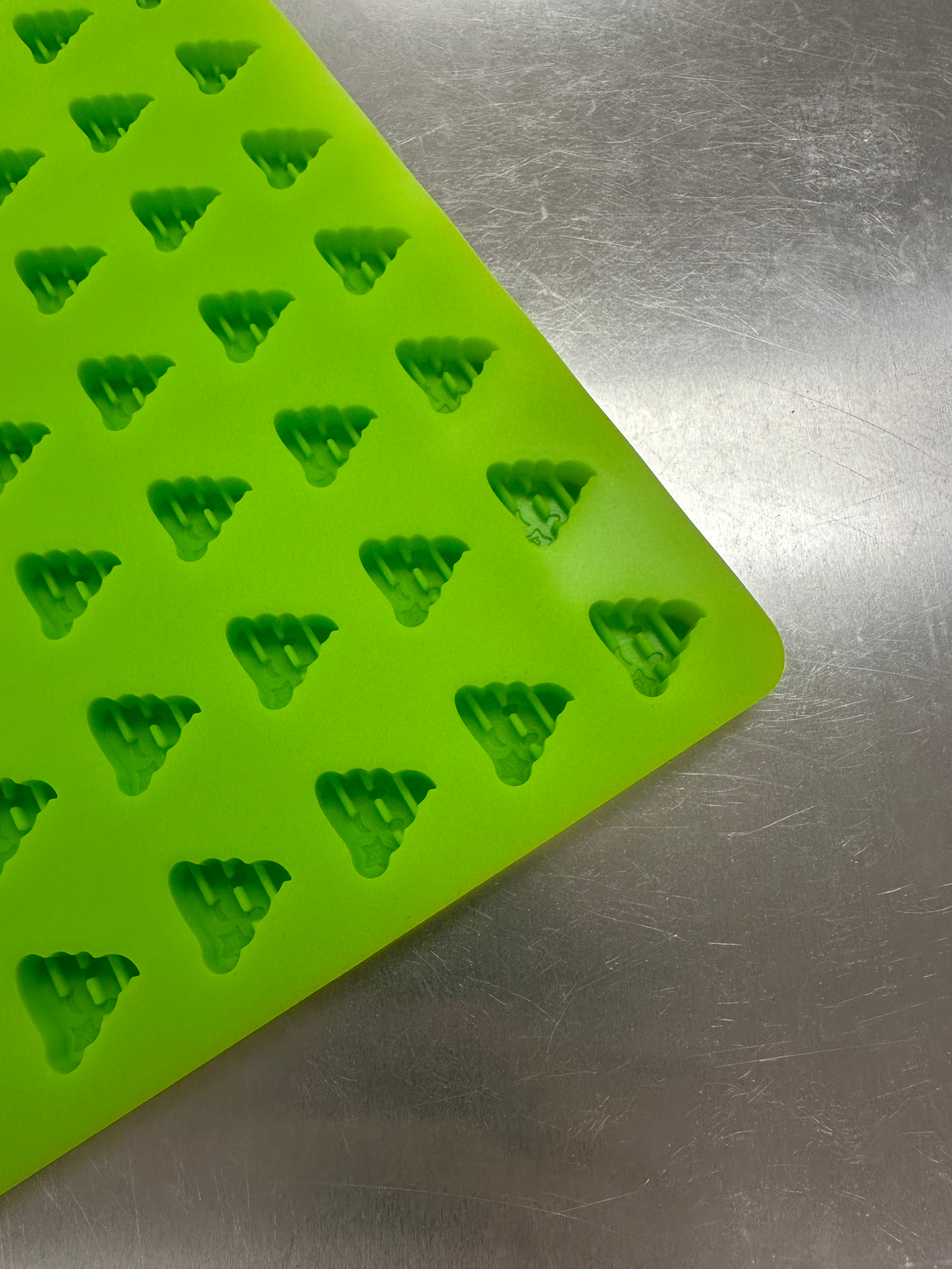 Angled close-up of poo shape cavities on Product 006