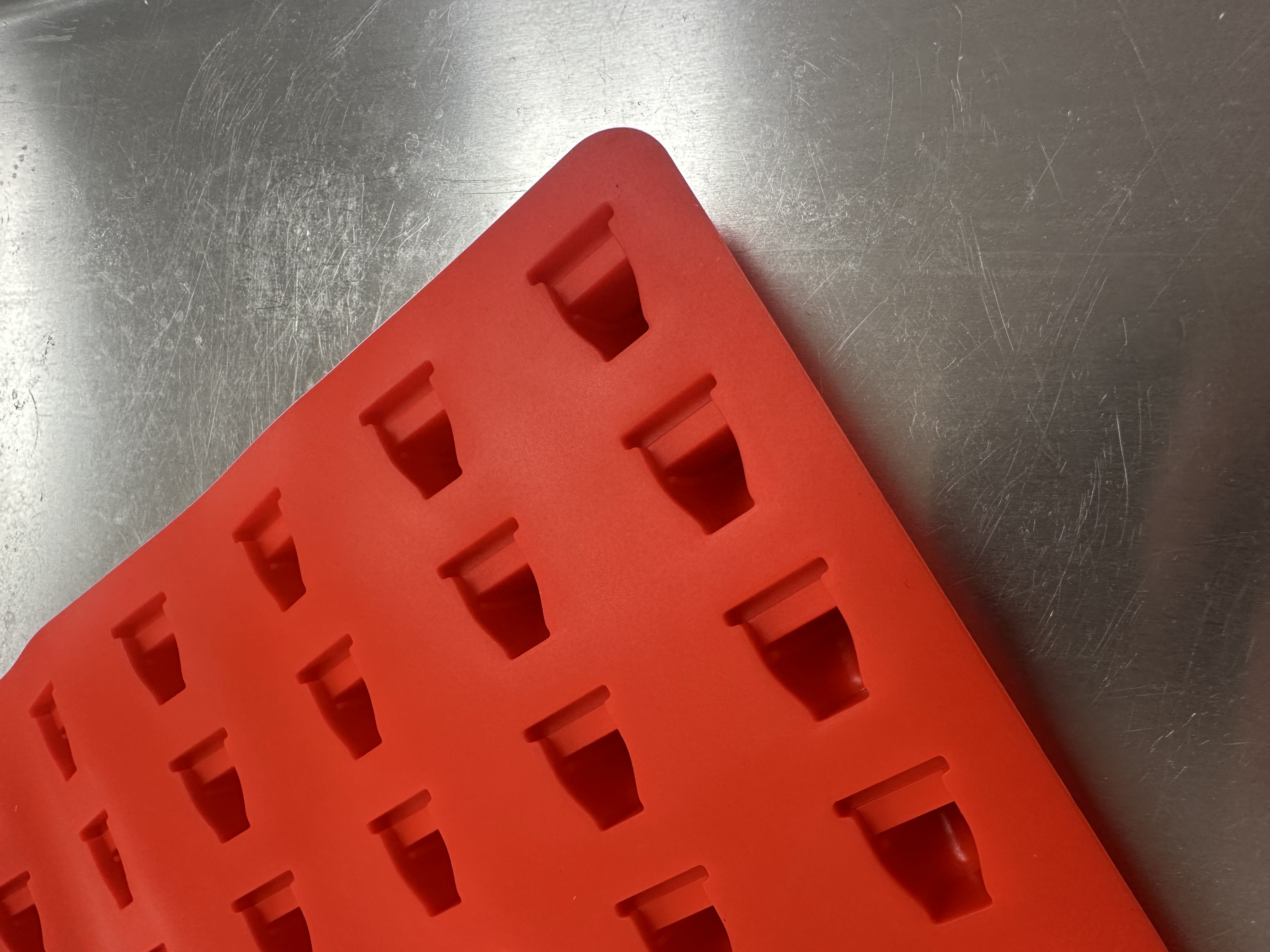 Angled close-up of toilet shape cavities on Product 008