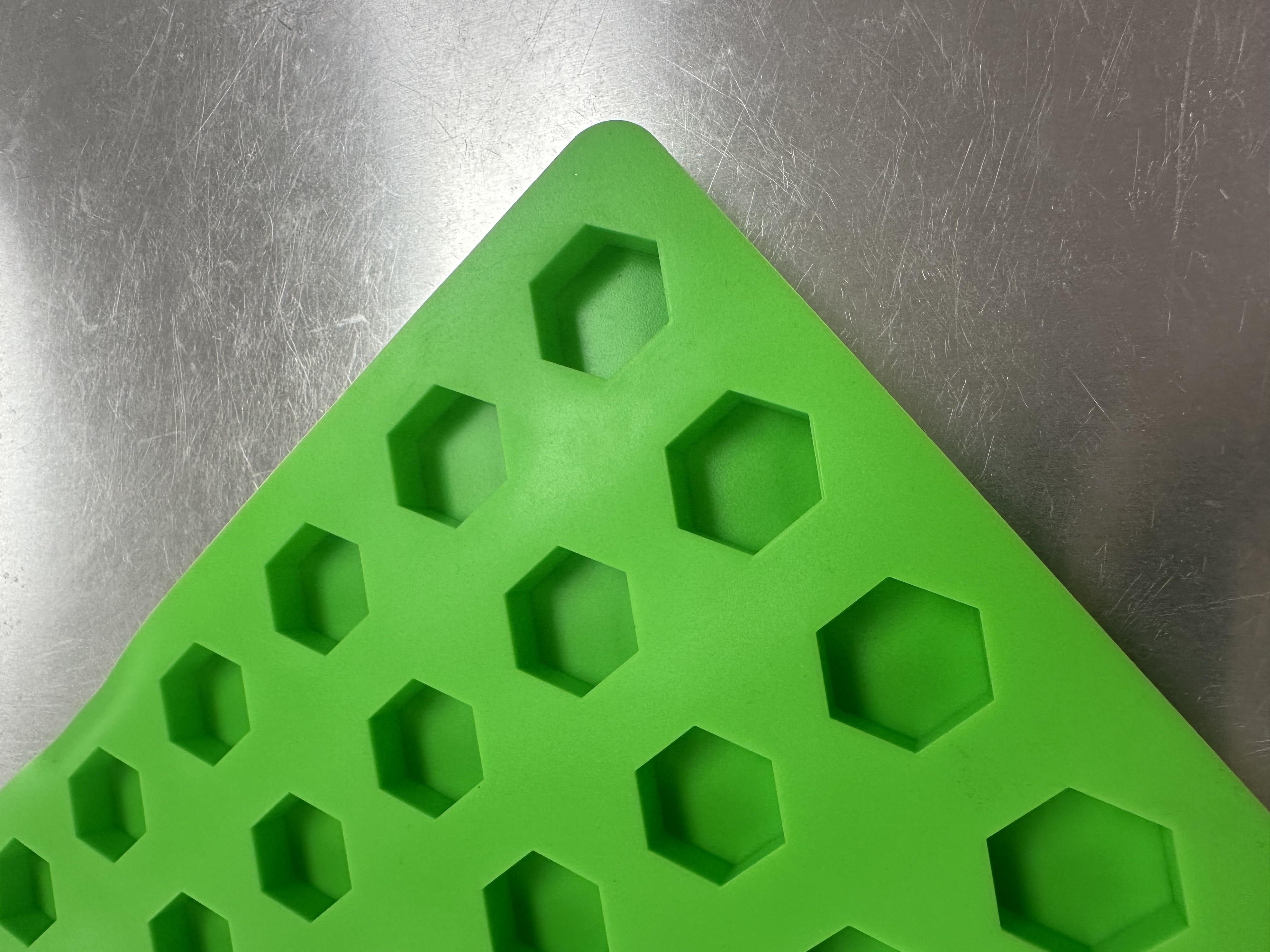 Angled close-up of hexagonal cavities on Product 010